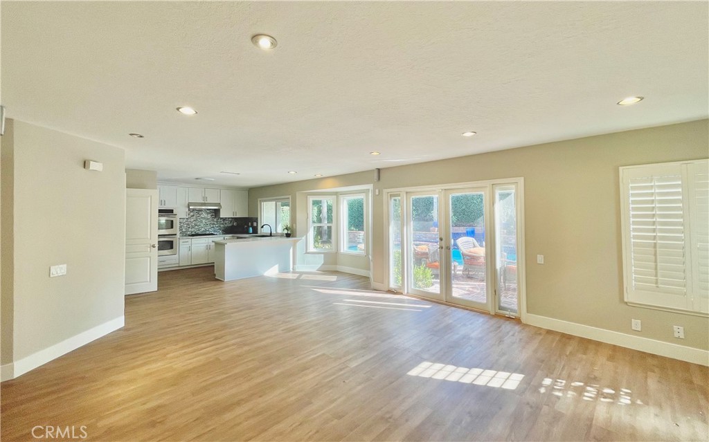 10 Ramada Irvine, CA 92620 - Photo 12 of 22 a view of an empty room with kitchen and window