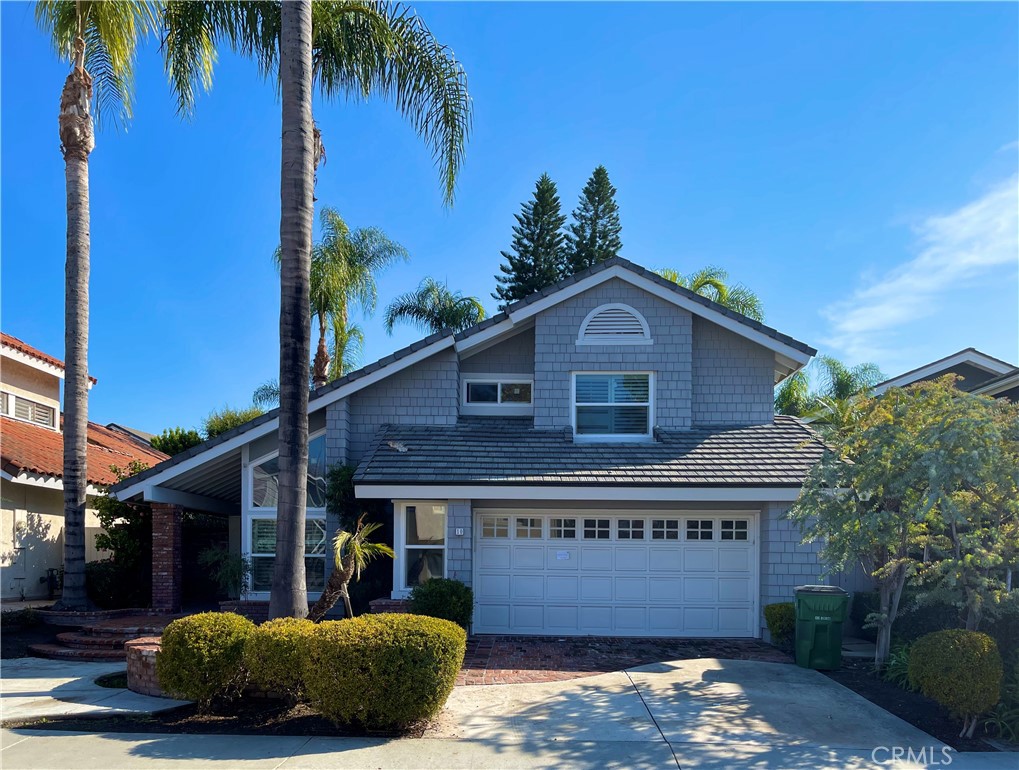 10 Ramada Irvine, CA 92620 - Photo 2 of 22 a front view of a house with a yard