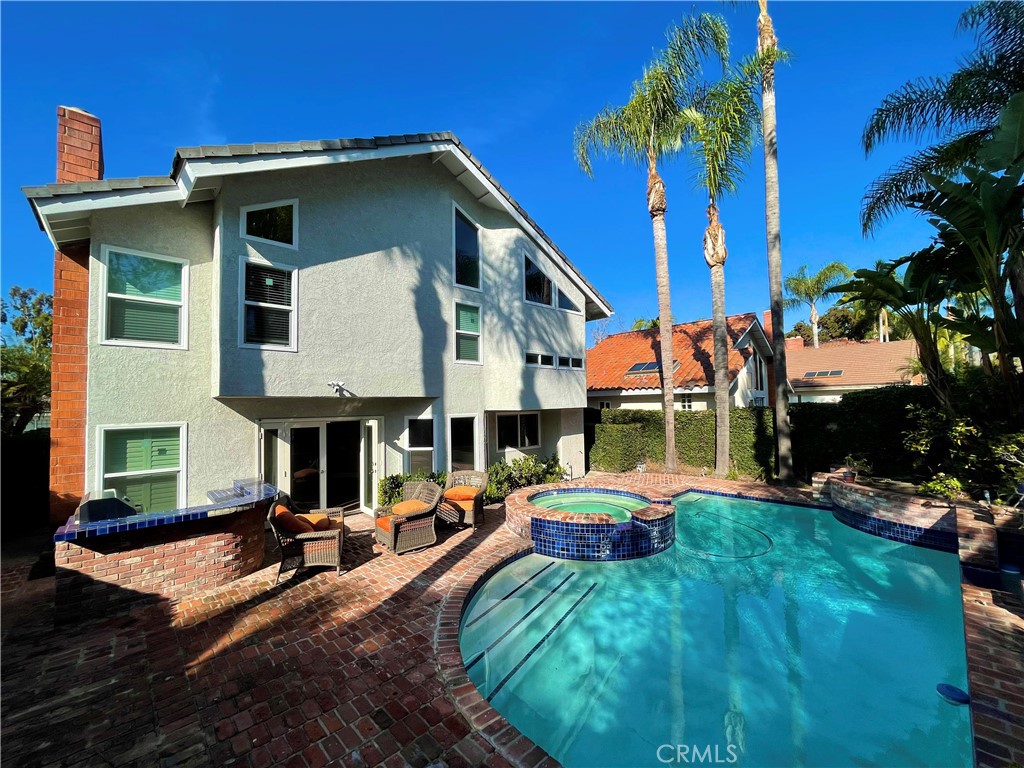 10 Ramada Irvine, CA 92620 - Photo 4 of 22 a front view of a house with swimming pool having outdoor seating