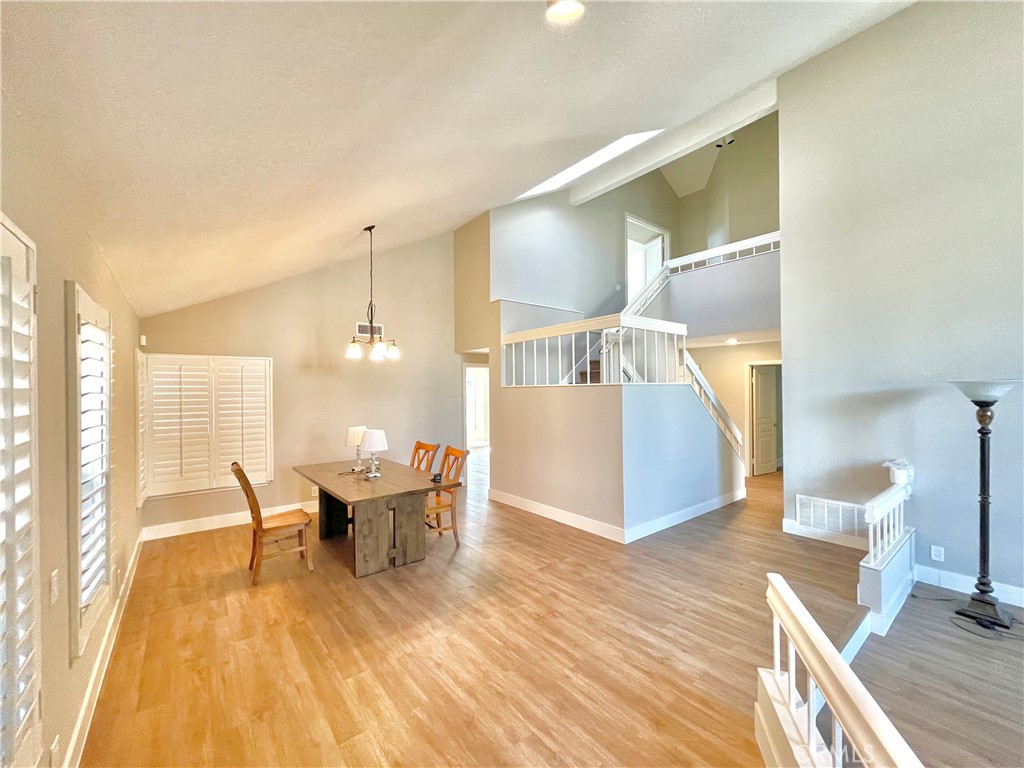 10 Ramada Irvine, CA 92620 - Photo 8 of 22 a view of a dining room with furniture and wooden floor