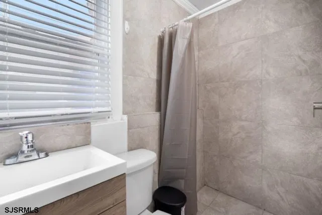 a bathroom with a sink and toilet