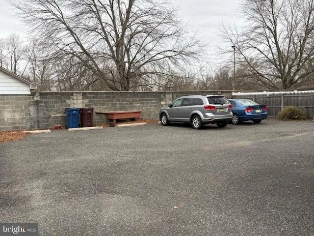 a view of street with parked cars