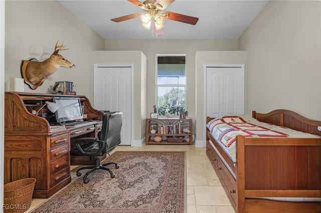 a bedroom with bed and a window