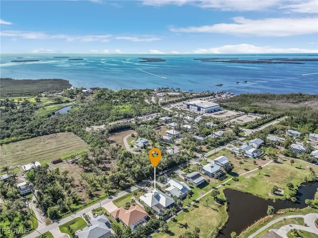 an aerial view of residential building and lake