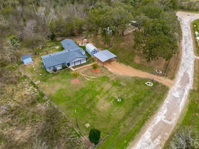 an aerial view of residential houses with outdoor space
