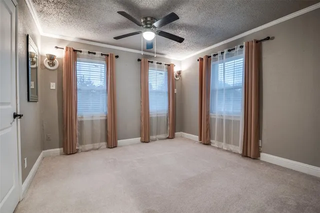 a kitchen with granite countertop wooden cabinets and stainless steel appliances