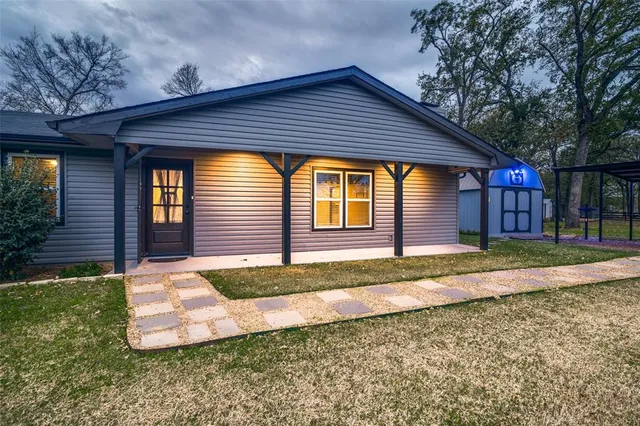 a front view of a house with garden