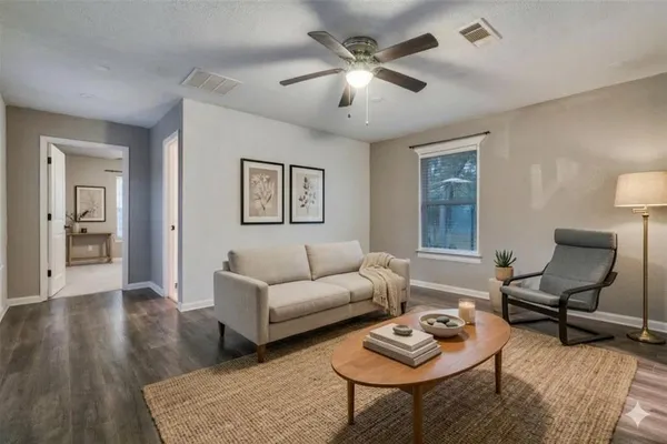 a living room with furniture and a window