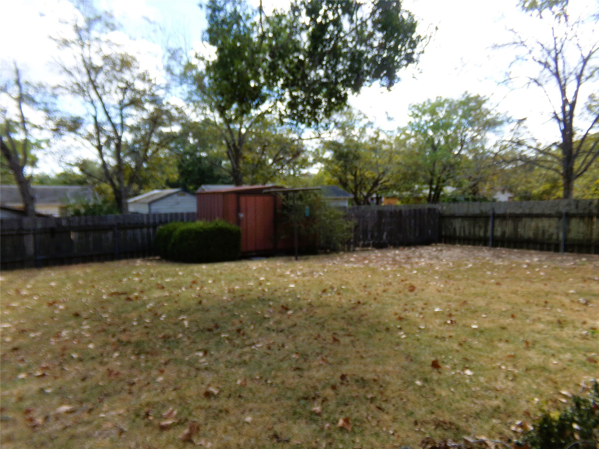 516 North College Street Weimar, TX 78962 - Photo 18 of 20 a backyard of a house with lots of green space