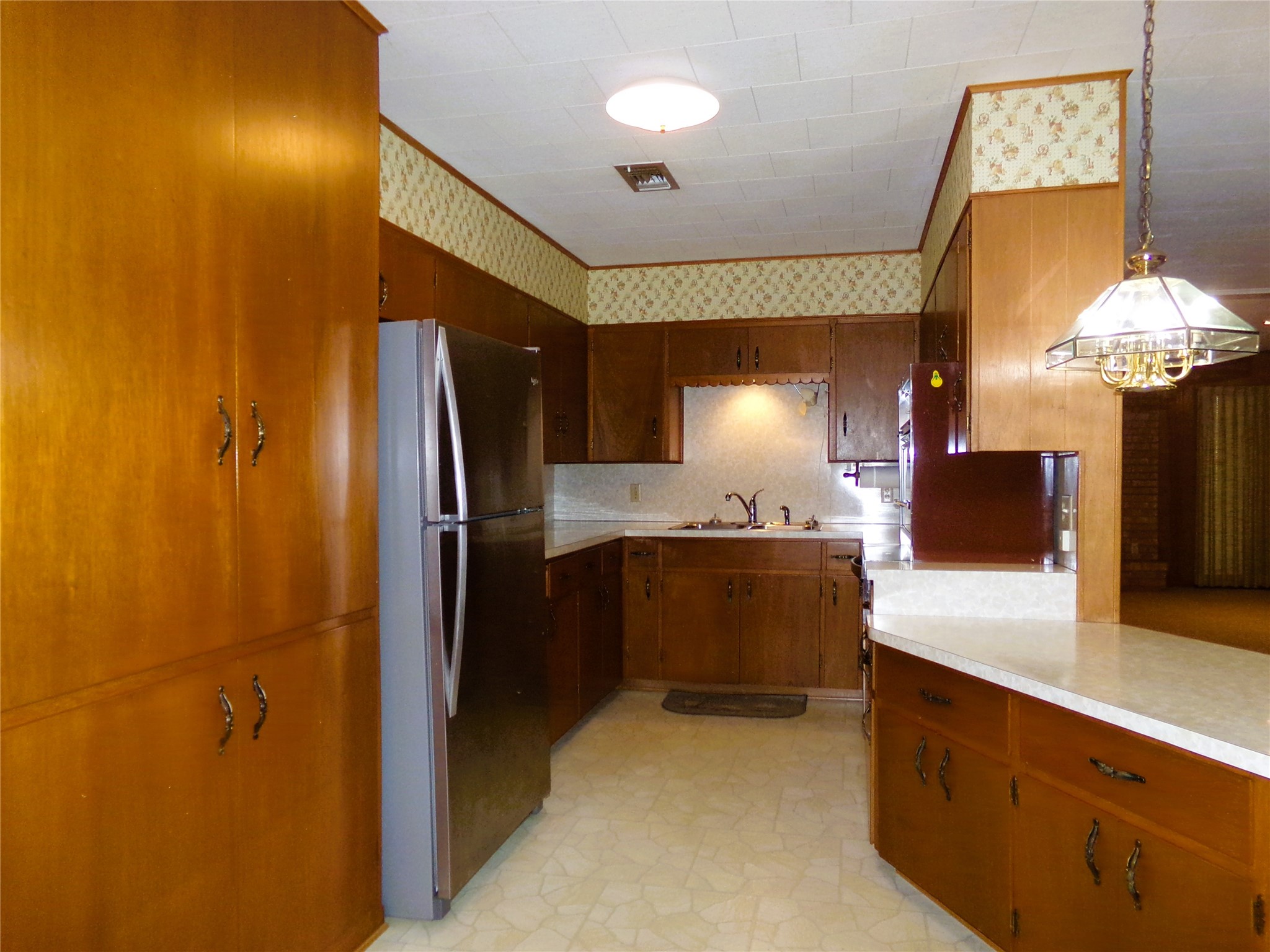 516 North College Street Weimar, TX 78962 - Photo 4 of 20 a bathroom with a double vanity sink and a mirror