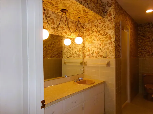 a bathroom with a shower and a sink