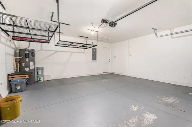 a view of storage and utility room with racks on the wall