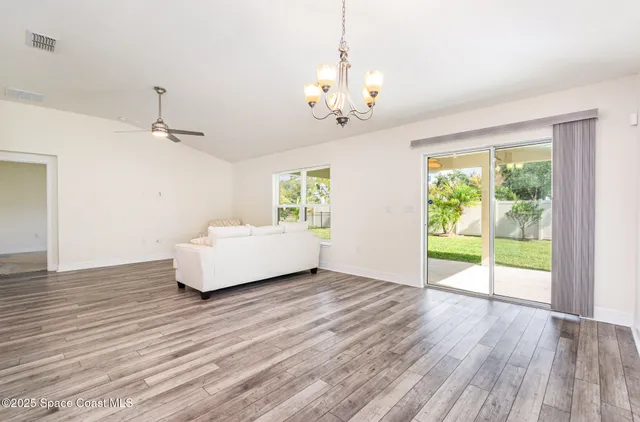 a spacious bedroom with a bed and a window