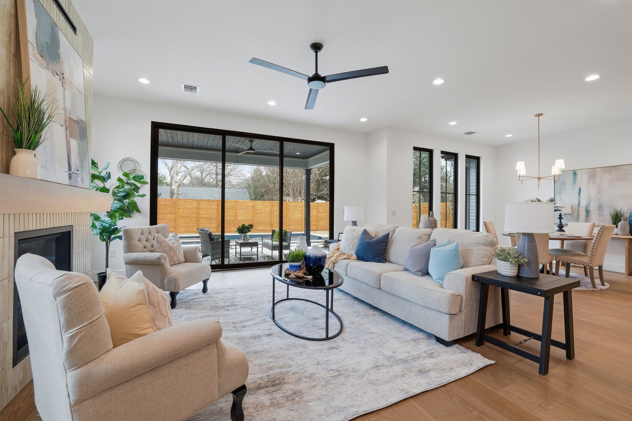 6611 Lexington Road Austin, TX 78757 - Photo 13 of 36 a living room with furniture ceiling fan and a large window