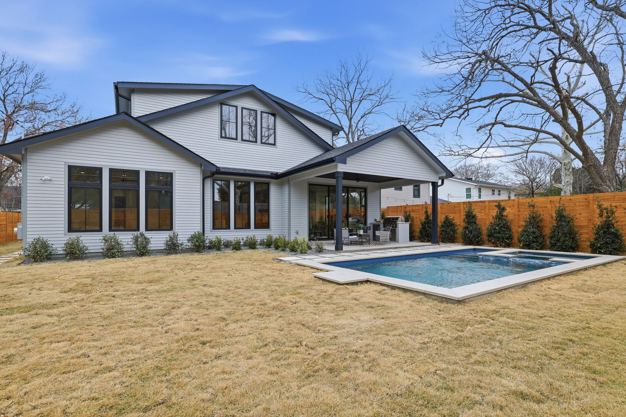6611 Lexington Road Austin, TX 78757 - Photo 36 of 36 a view of a house with pool and chairs