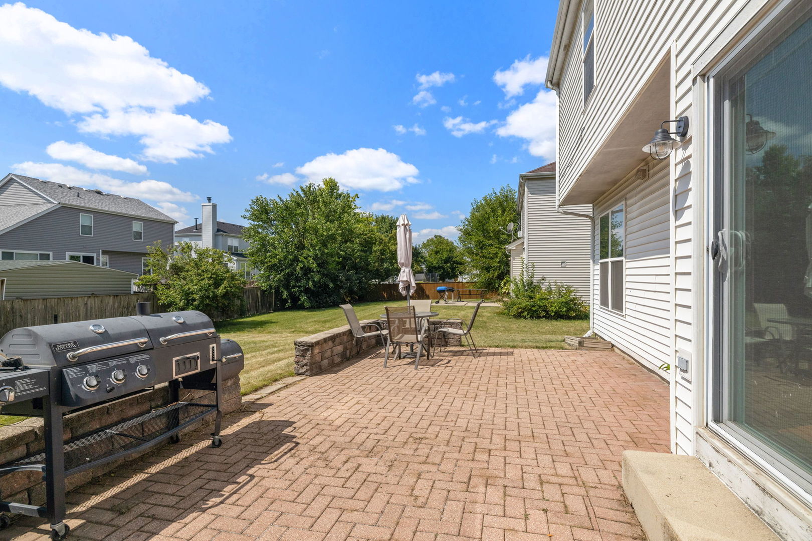 601 Greystone Lane Bolingbrook, IL 60440 - Photo 19 of 20 a view of a patio with a table and chairs