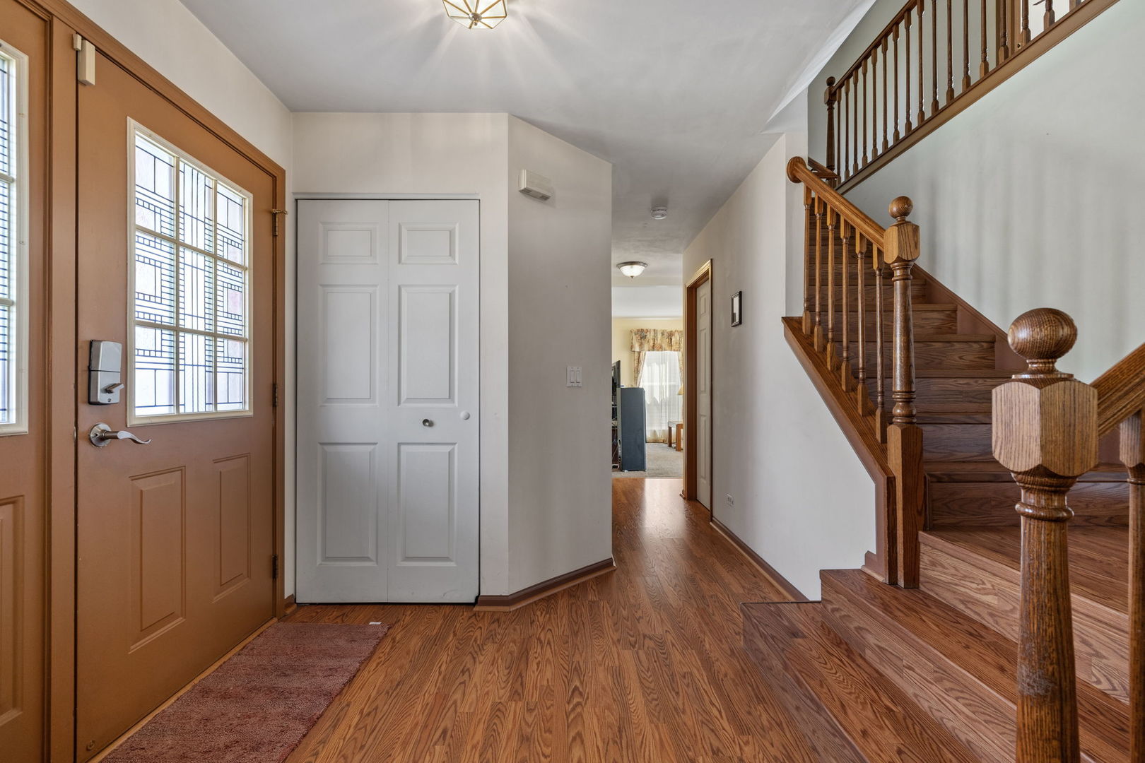 601 Greystone Lane Bolingbrook, IL 60440 - Photo 2 of 20 a view of entryway with wooden floor and stairs