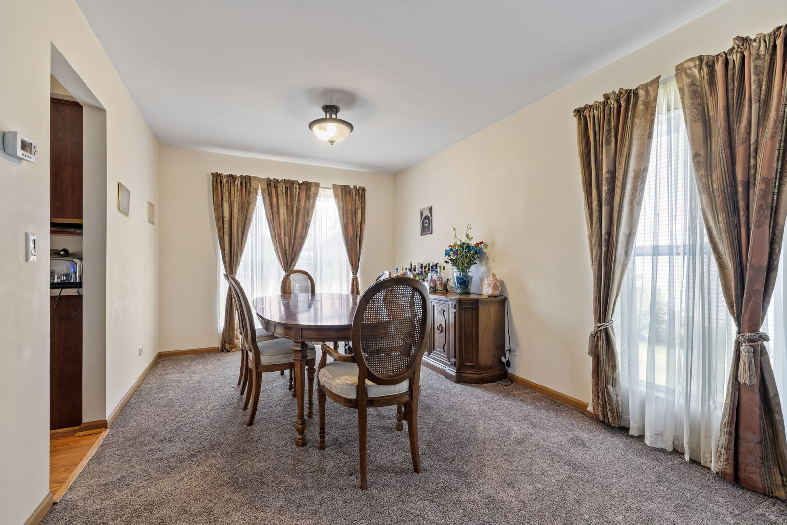 601 Greystone Lane Bolingbrook, IL 60440 - Photo 5 of 20 a view of a dining room with furniture window and outside view