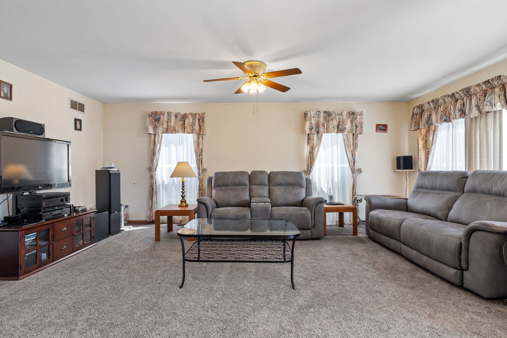 601 Greystone Lane Bolingbrook, IL 60440 - Photo 10 of 20 a living room with furniture and a flat screen tv