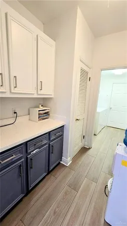 a view of a kitchen with electric appliances