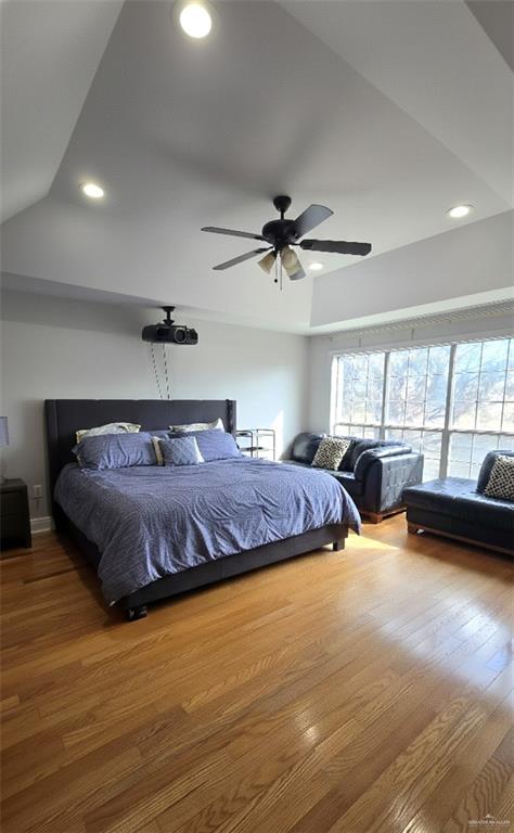 2202 Colorado Street Mission, TX 78572 - Photo 14 of 19 Bedroom featuring light wood finished floors, recessed lighting, lofted ceiling, and a ceiling fan