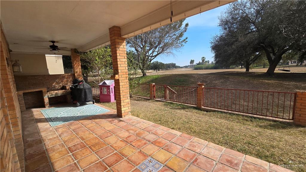 2202 Colorado Street Mission, TX 78572 - Photo 19 of 19 Fenced backyard featuring a ceiling fan, a patio, and a grill