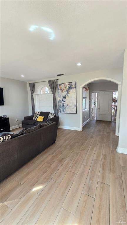 2202 Colorado Street Mission, TX 78572 - Photo 4 of 19 Living area featuring arched walkways and wood tiled floors