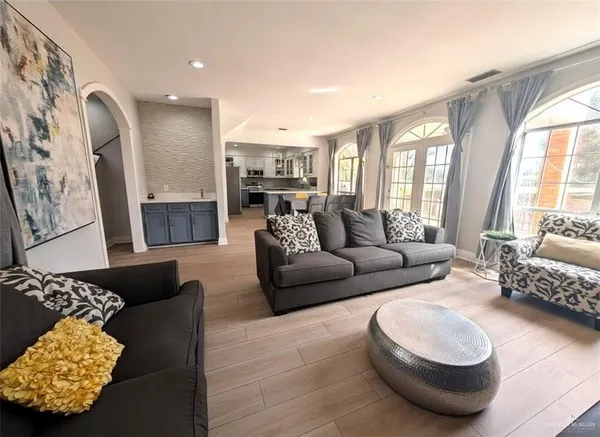 a living room with furniture and a large window