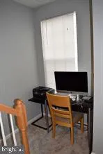 a view of a workspace with furniture