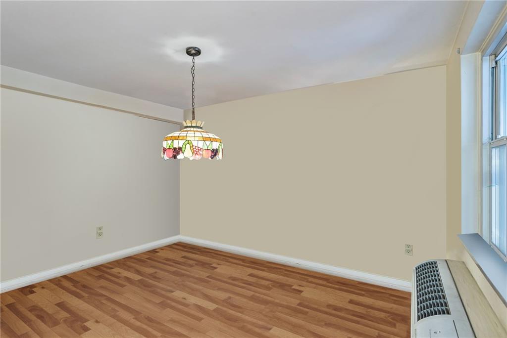 4625 Fifth Avenue, Unit 116 Pittsburgh, PA 15213 - Photo 12 of 25 a view of a room with wooden floor and chandelier