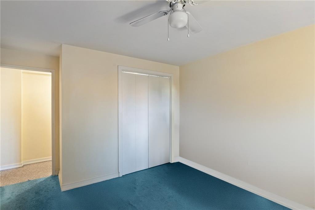 4625 Fifth Avenue, Unit 116 Pittsburgh, PA 15213 - Photo 17 of 25 an empty room with a chandelier fan