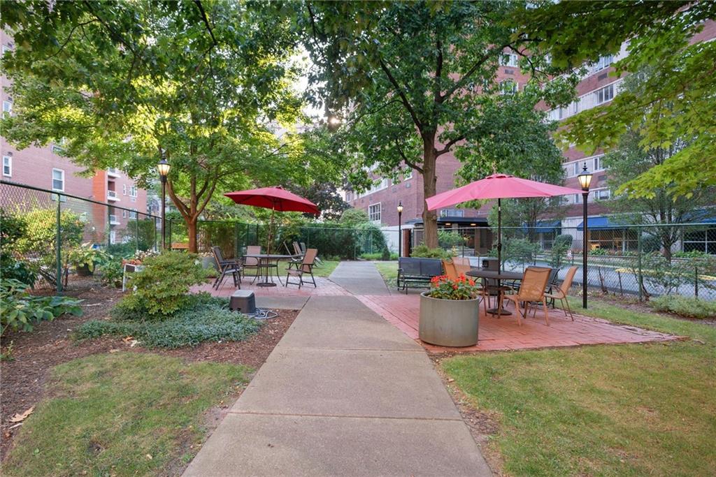 4625 Fifth Avenue, Unit 116 Pittsburgh, PA 15213 - Photo 20 of 25 an outdoor sitting space with an umbrella