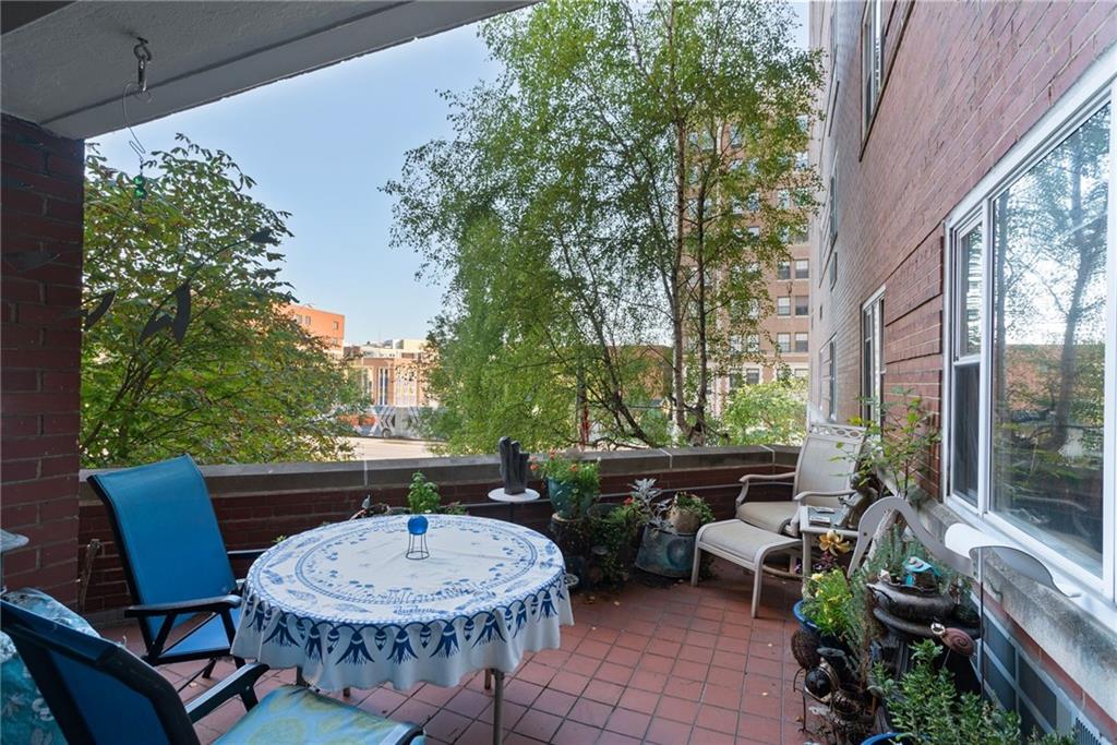 4625 Fifth Avenue, Unit 116 Pittsburgh, PA 15213 - Photo 6 of 25 a outdoor space with a table and a chairs