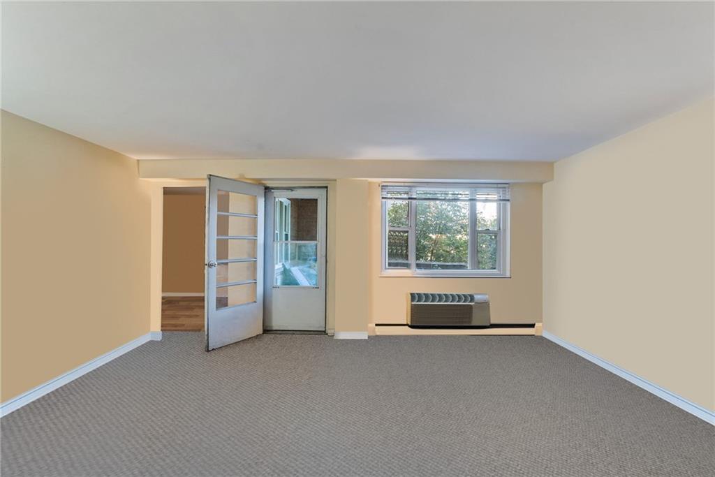 4625 Fifth Avenue, Unit 116 Pittsburgh, PA 15213 - Photo 9 of 25 an empty room with windows