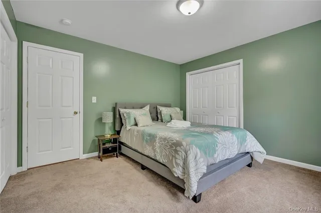 a bed sitting in a room next to a window