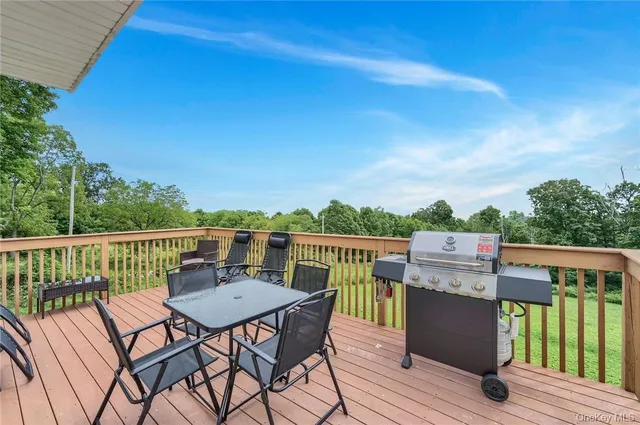 a view of a balcony with furniture