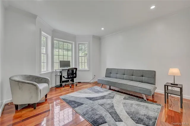 a living room with furniture and a lamp