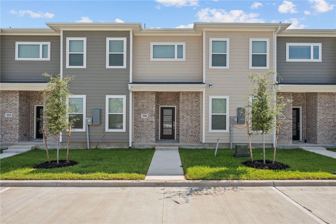 3213 Link Street, Unit 114 Bryan, TX 77801 - Photo 2 of 25 a front view of a house with a yard and plants