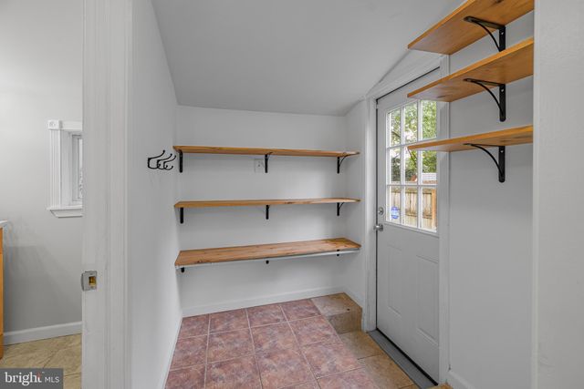 a room that has a rug and a window