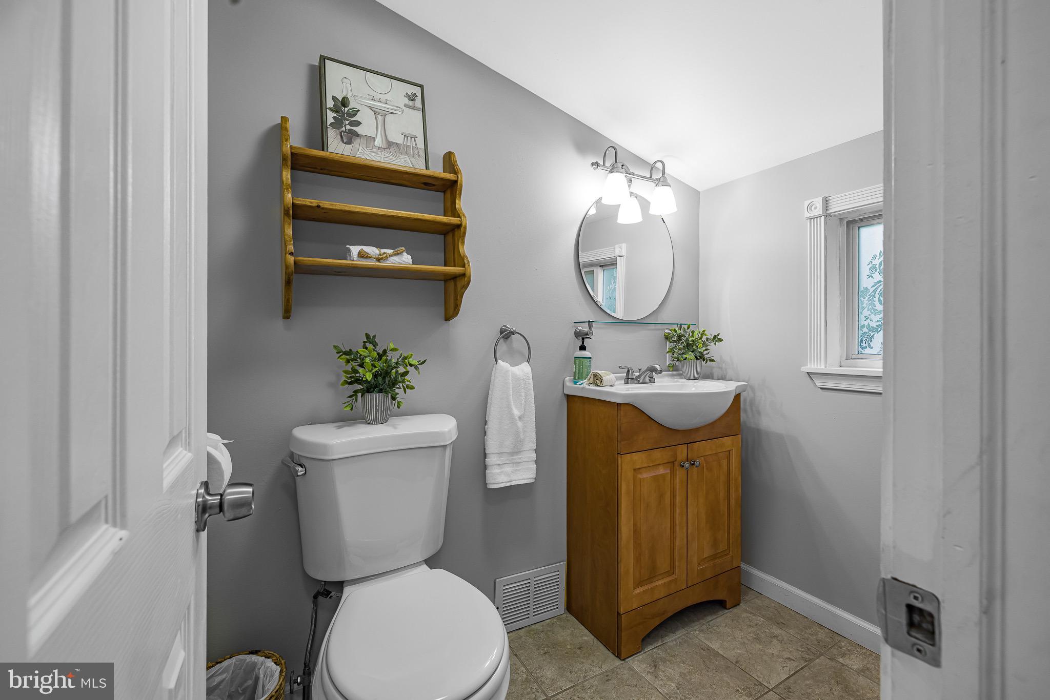 13 Winter Street Media, PA 19063 - Photo 19 of 41 a bathroom with a toilet a sink and a mirror