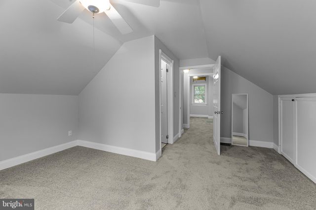 an empty room with a empty space and windows