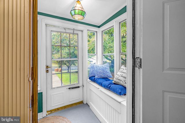 a bathroom with a tub and a window