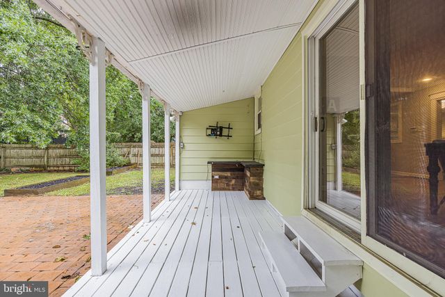 a house view with a seating space and wooden floor