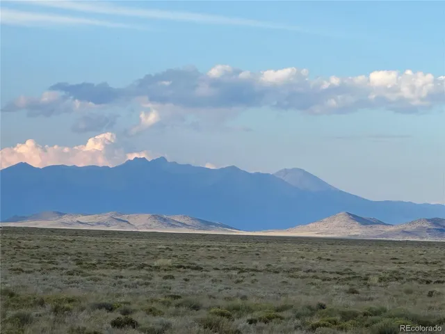 a view of an ocean and a mountain