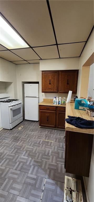 901 6th Street Braddock, PA 15104 - Photo 18 of 25 a kitchen with stainless steel appliances granite countertop a stove and a refrigerator