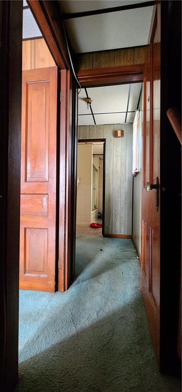 901 6th Street Braddock, PA 15104 - Photo 5 of 25 a view of a hallway with wooden walls and windows