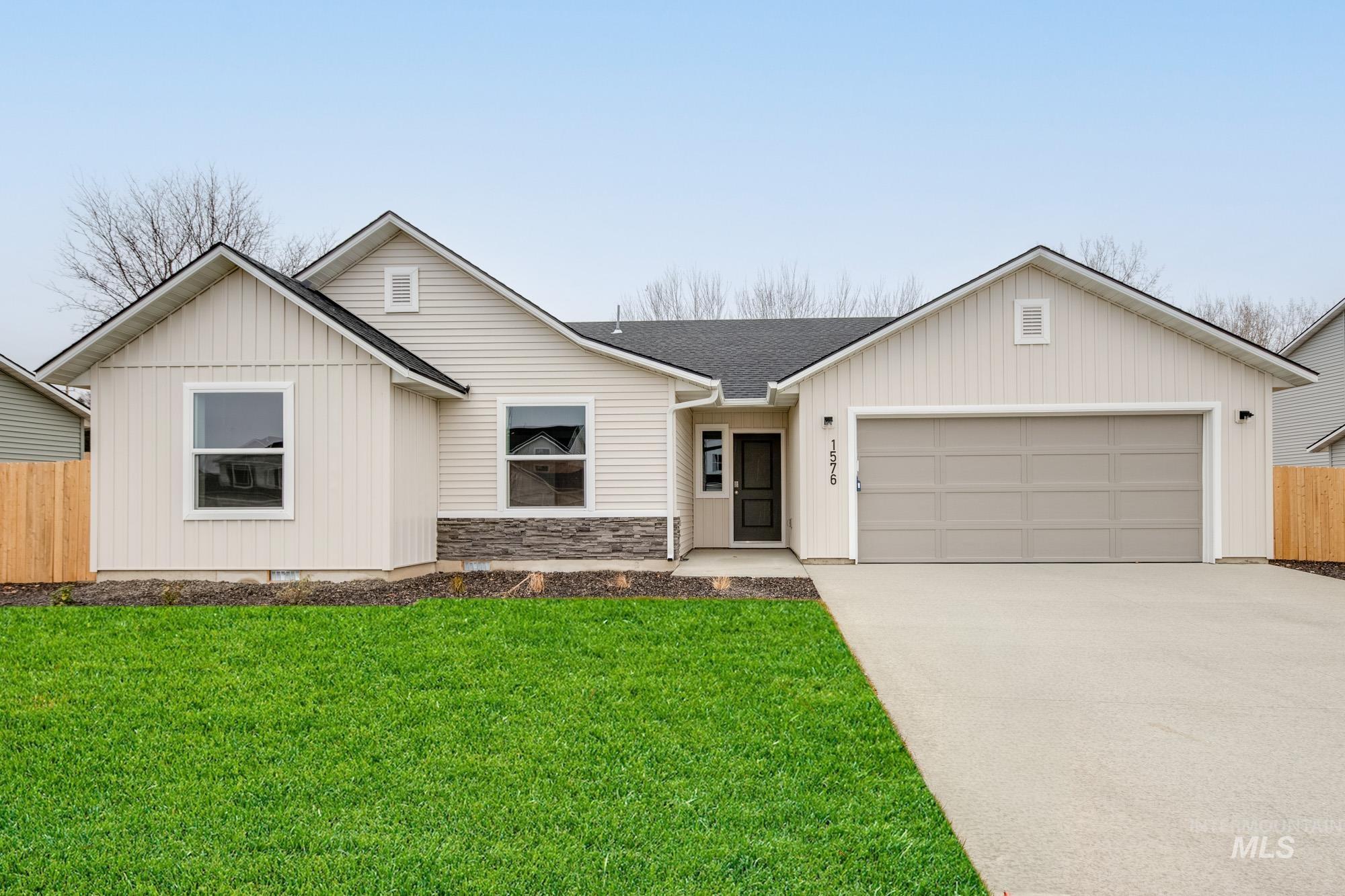 1576 Long Pond Street Middleton, ID 83644 - Photo 1 of 22 Ranch-style house with concrete driveway, an attached garage, board and batten siding, and roof with shingles