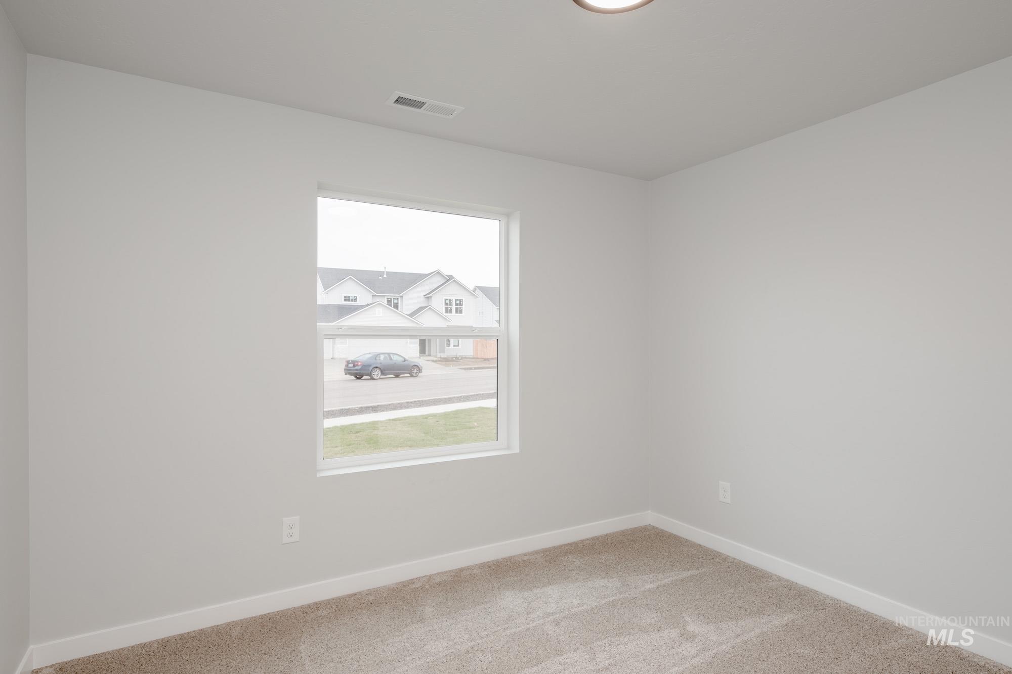 1576 Long Pond Street Middleton, ID 83644 - Photo 14 of 22 Unfurnished room featuring carpet floors