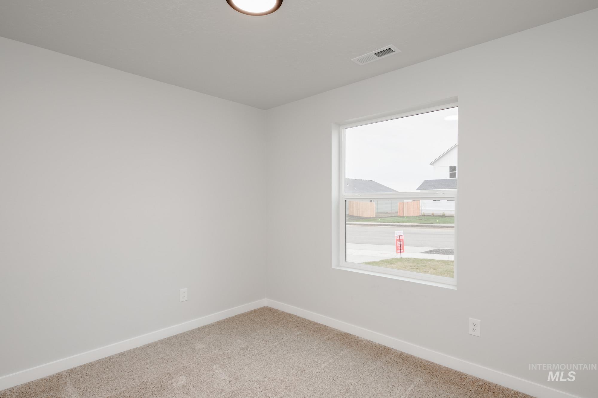 1576 Long Pond Street Middleton, ID 83644 - Photo 15 of 22 Empty room with baseboards and light colored carpet