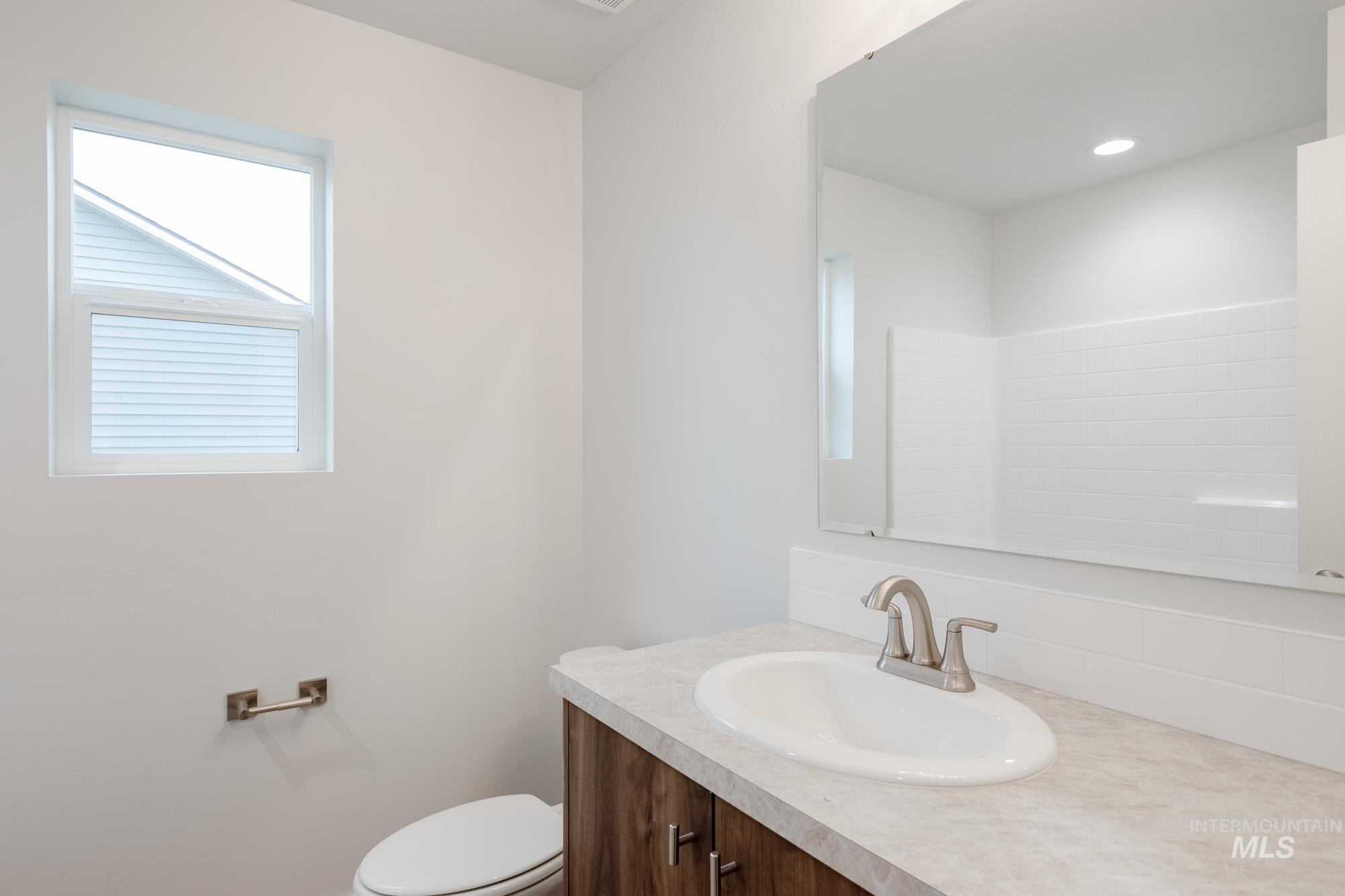 1576 Long Pond Street Middleton, ID 83644 - Photo 16 of 22 Bathroom with vanity and toilet
